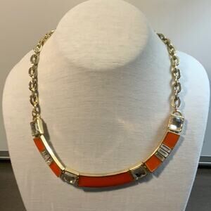 express orange and gold toned necklace